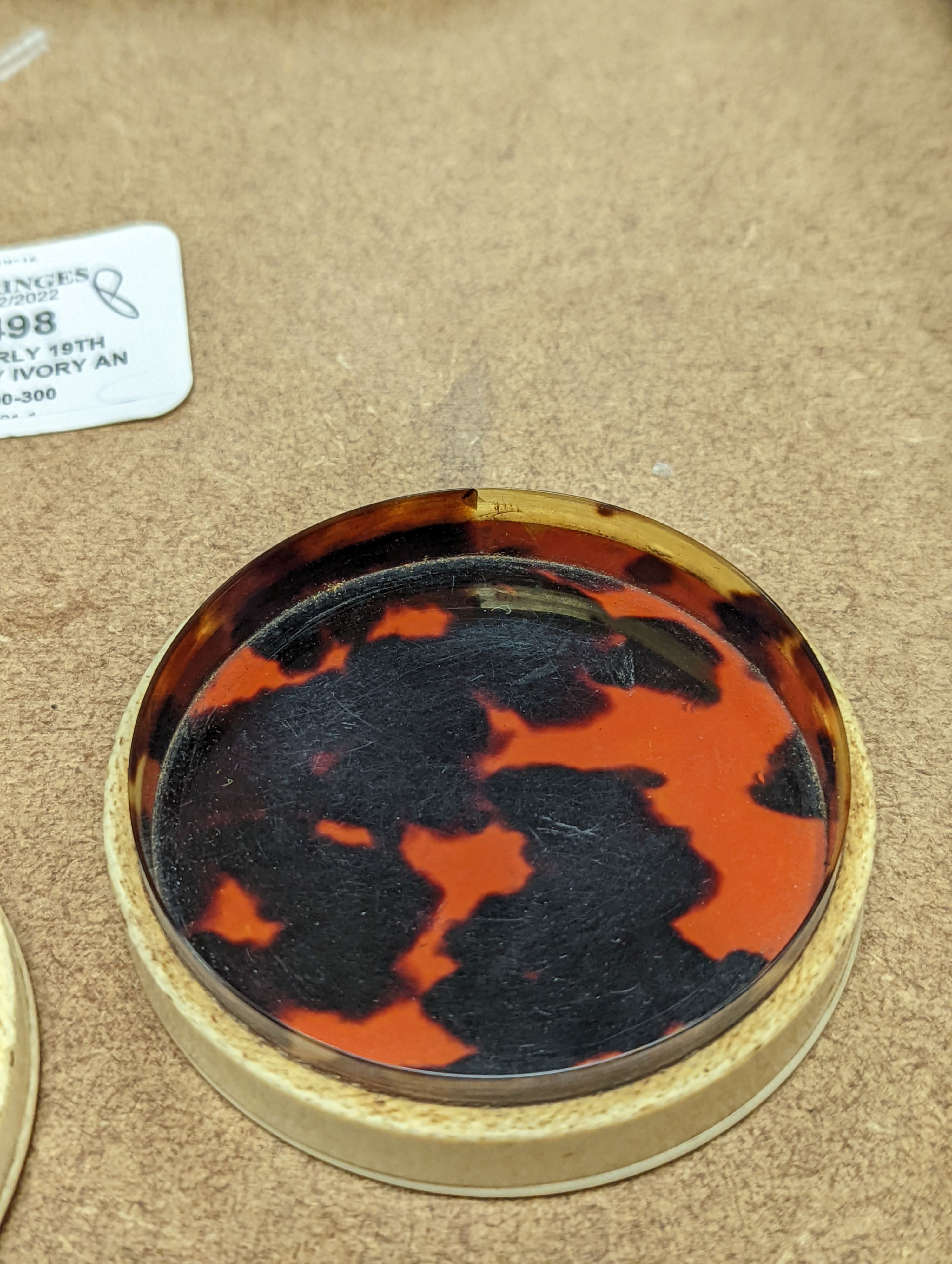 An early 19th century ivory and tortoishell box with inset miniature of Themis to cover, 8cm.